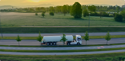 Tank truck on a motorway at sunset — bulk liquid transport
