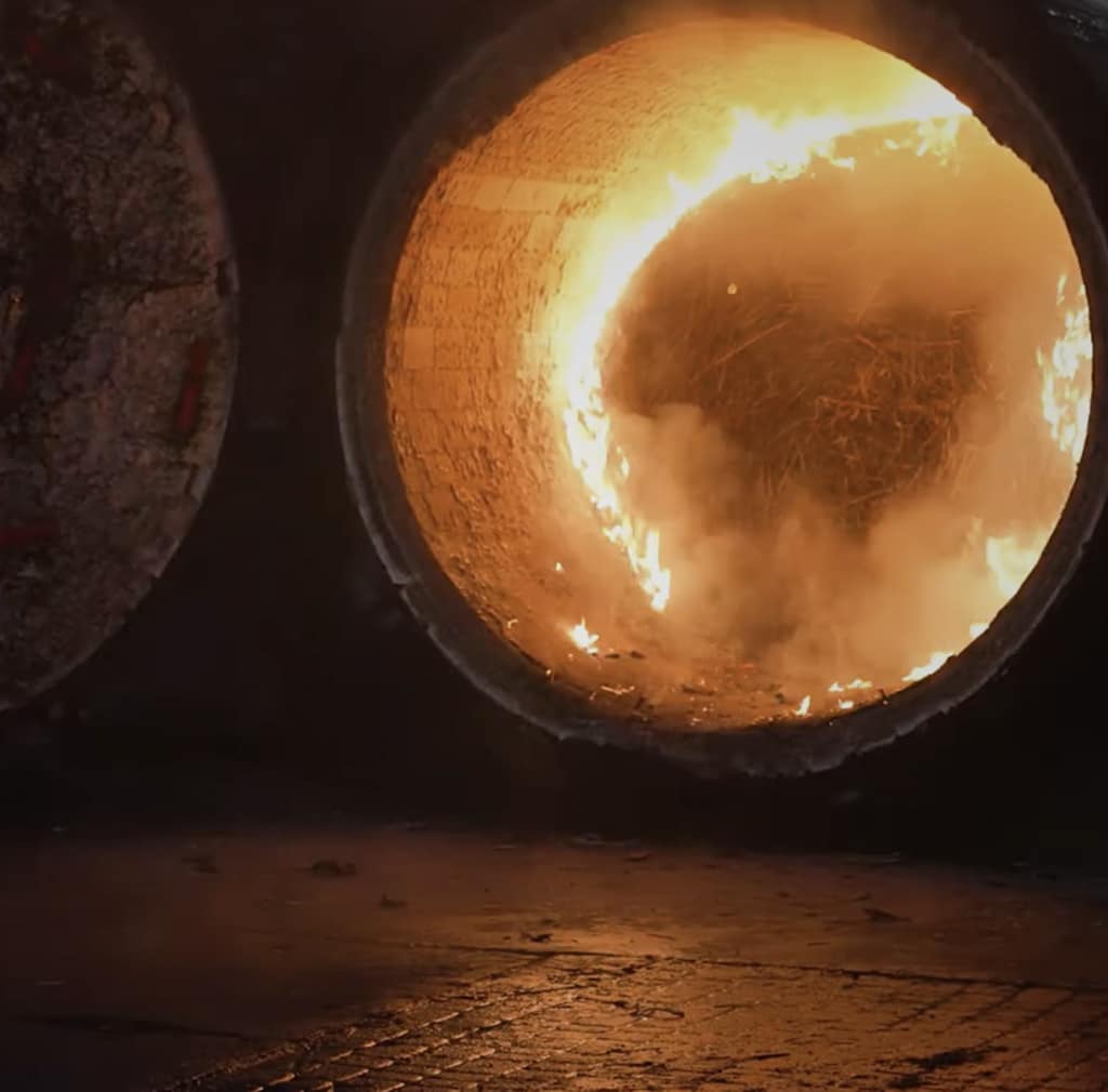 Flame inside the Alquora distillery boiler burning straw biomass