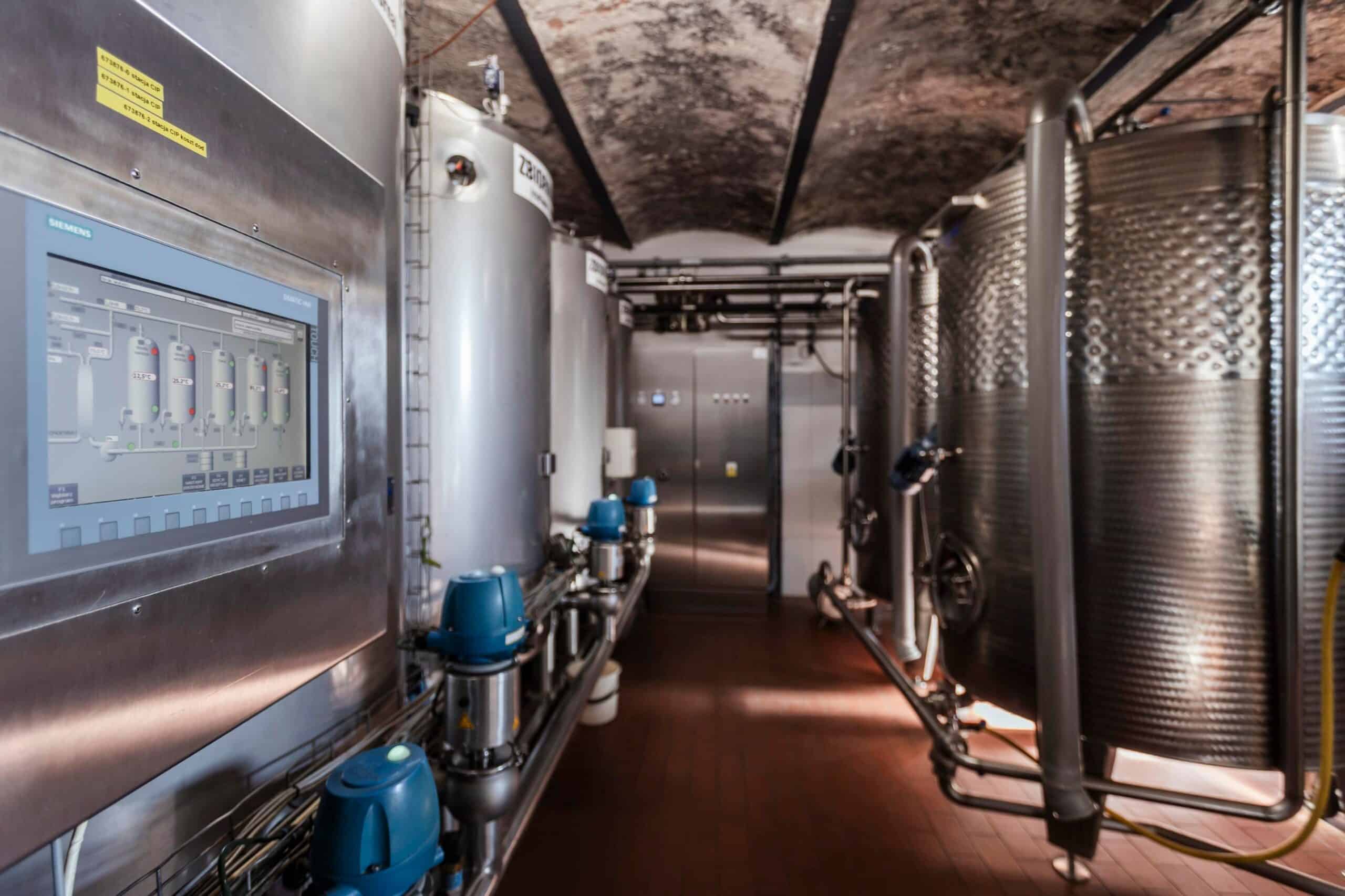 Cleaning station and yeast propagation tanks in a distillery's vaulted cellar